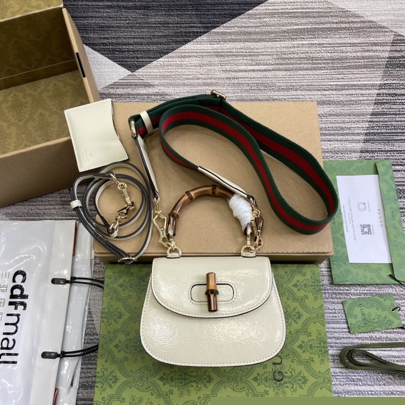 G*u*i top handle bags